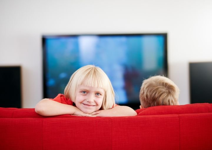 Two children from Sweden watching TV - Design by Canva Pro